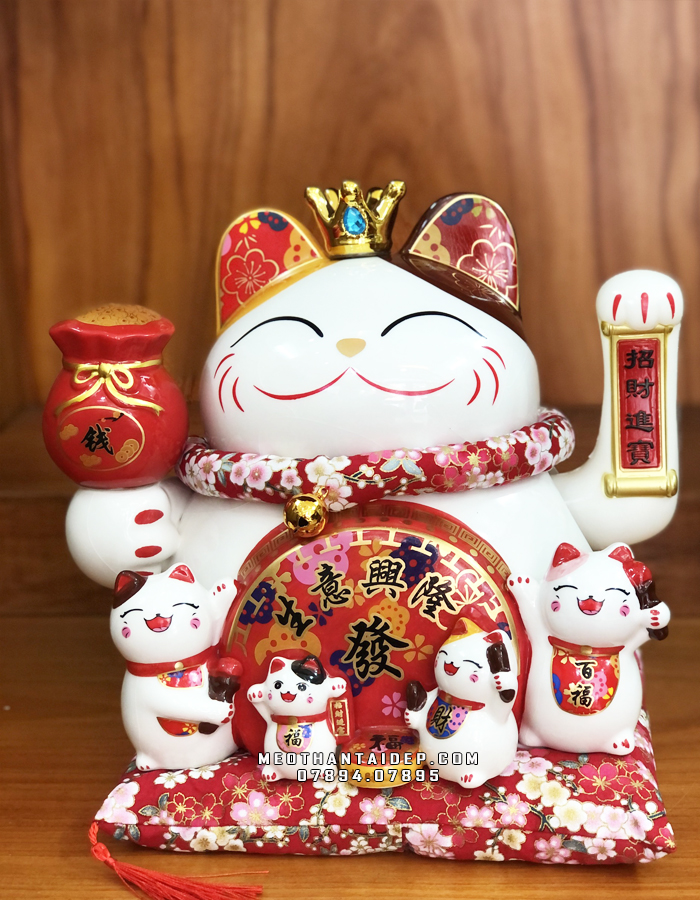 mèo thần tài vẫy tay nâng túi kim bảo đẹp