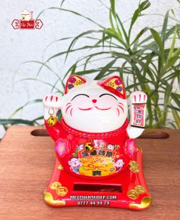 Mèo Thần Tài năng lượng đỏ cầm chuông vàng túi vàng