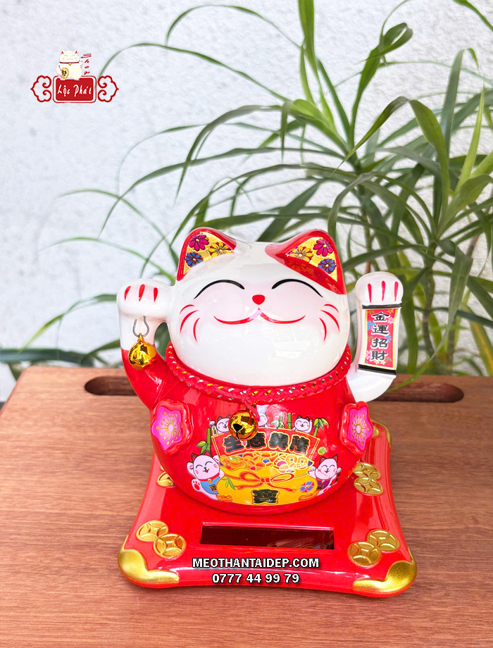 Mèo Thần Tài năng lượng đỏ cầm chuông vàng túi vàng