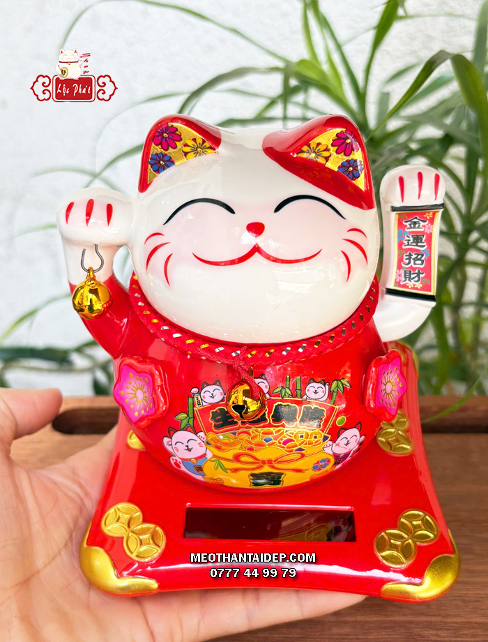Mèo Thần Tài năng lượng đỏ cầm chuông vàng túi vàng