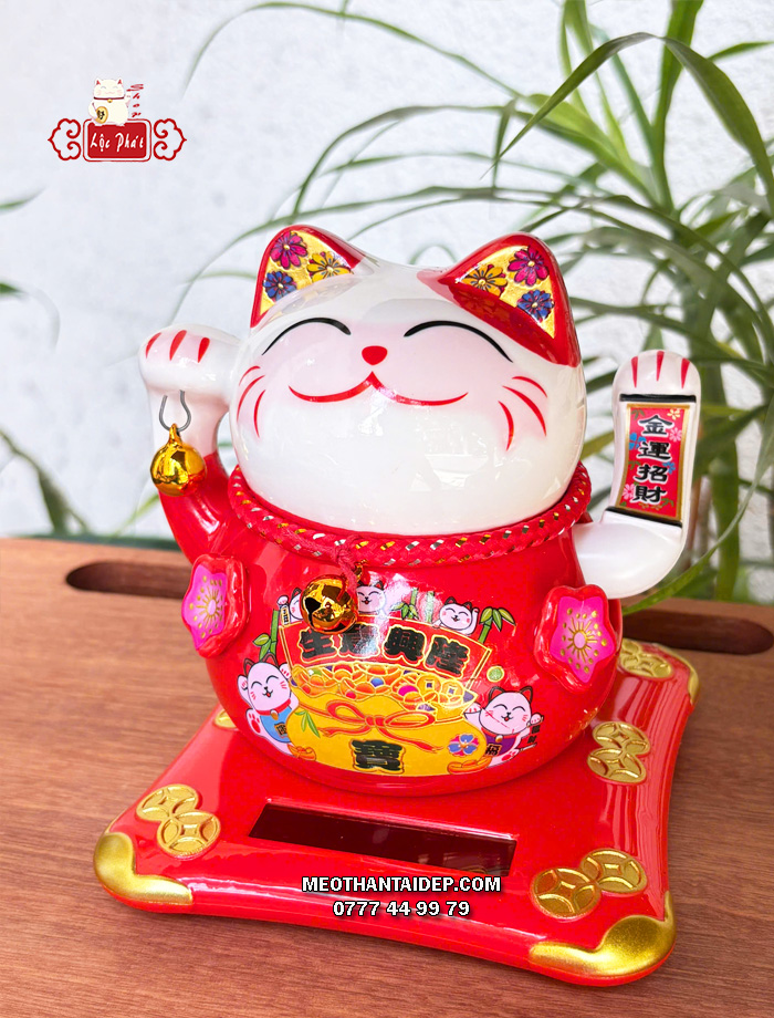 Mèo Thần Tài năng lượng đỏ cầm chuông vàng túi vàng