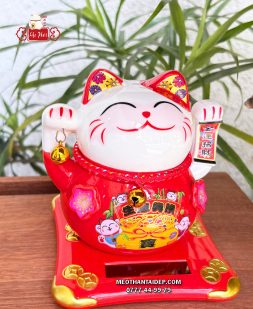 Mèo Thần Tài năng lượng đỏ cầm chuông vàng túi vàng