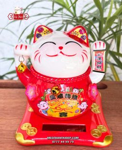 Mèo Thần Tài năng lượng đỏ cầm chuông vàng túi vàng