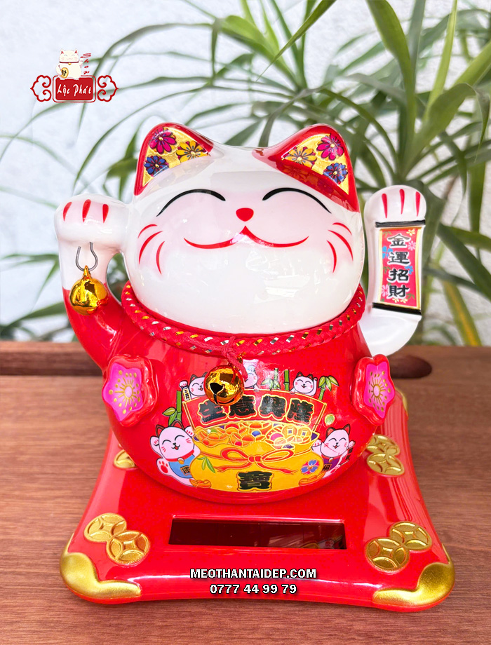 Mèo Thần Tài năng lượng đỏ cầm chuông vàng túi vàng